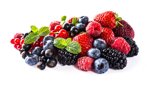 istock Mix berries isolated on a white. Ripe blueberries, blackberries, raspberries, currants and strawberries with mint. Berries and fruits with copy space for text. Various fresh summer berries on white background. Background berries. 918851396