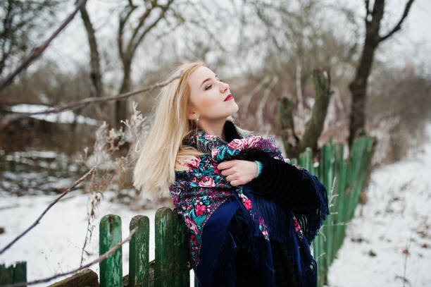 istock Blonde girl posed at winter snowy day. 918851490
