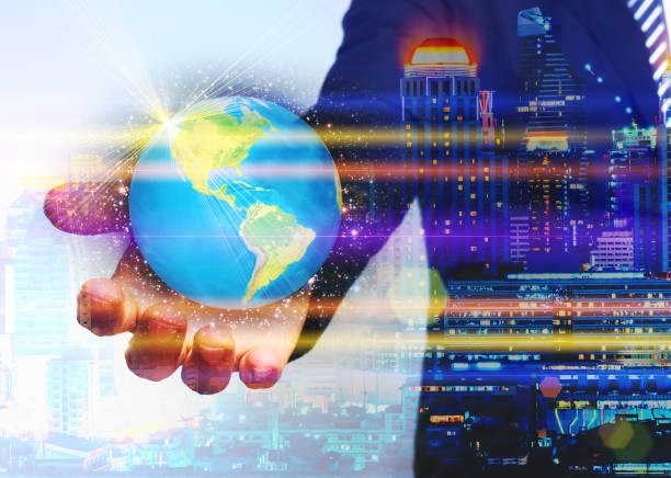 istock Double exposure of businessman hand hold the earth as business.Evolution and technology concept. 918854904