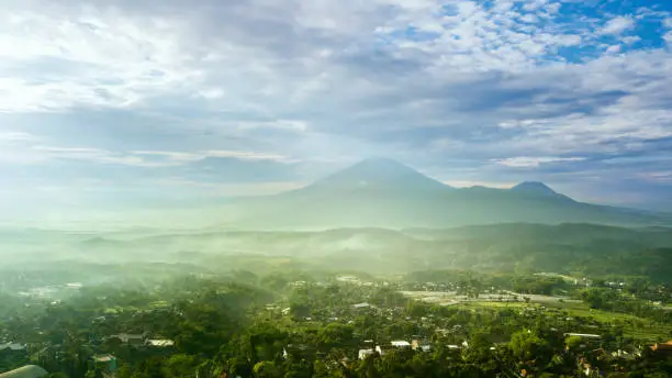 Beautiful landscape of mountain with mist at morning time, Semarang, Indonesia