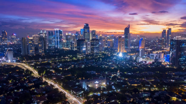 Beautiful nightfall sky above downtown Jakarta, Indonesia. February 09, 2018: beautiful nightfall sky above office building in downtown jakarta skyline stock pictures, royalty-free photos & images