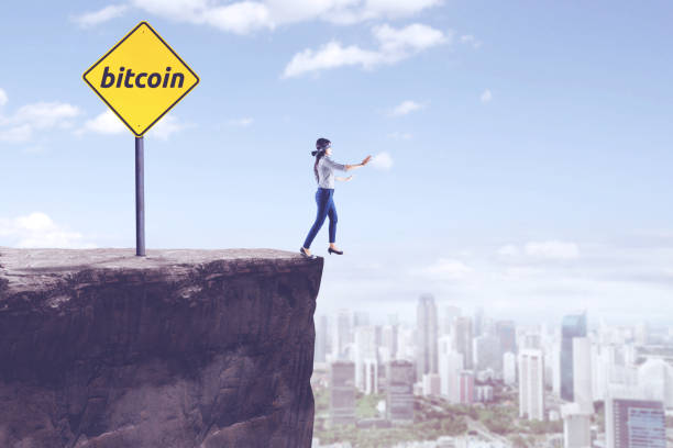 istock Blindfolded businesswoman with bitcoin word 918856506