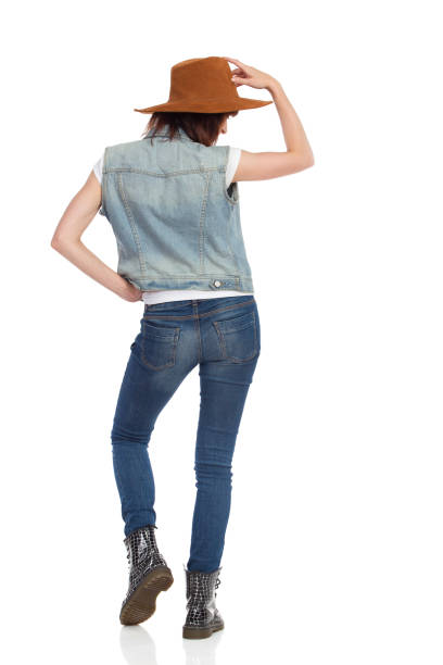 istock Young Woman Is Posing In Brown Hat. Rear View. 918861294