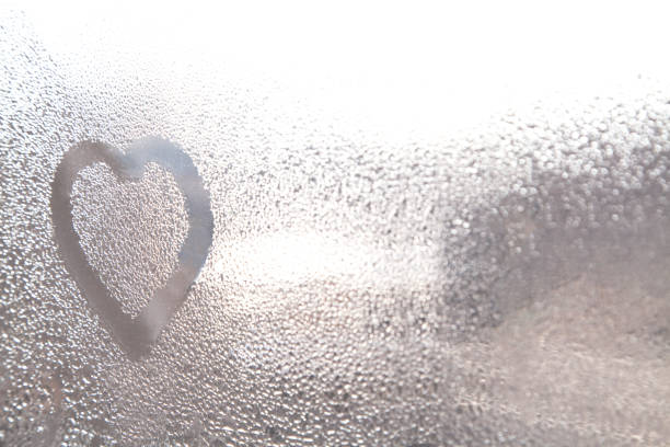 istock Heart on the foggy window. 918865324