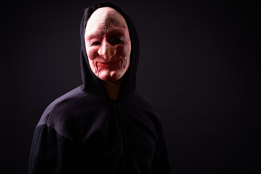 Studio Shot Of Scary Horror Man With Mask Ready For Halloween