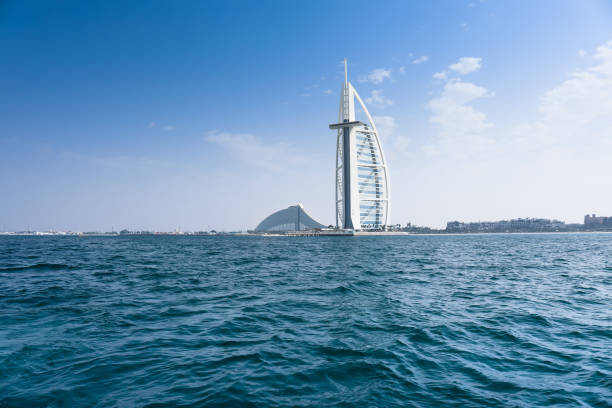 Burj Al Arab and Jumeirah beach hotel Dubai, UAE – January 28 2018 : The iconic 5 star Hotel Burj Al Arab and jumeirah beach hotel, The Burj Al Arab is a luxury hotel located in Dubai, United Arab Emirates. It is the third tallest hotel in the world . khalifa stock pictures, royalty-free photos & images