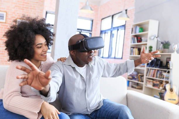 istock Mixed race family playing with VR 918872672
