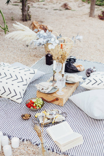 istock Romantic picnic in park in bohemian style 918873122