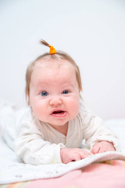 istock Little white baby girl  lying on a blanket. 918873174