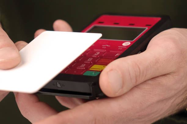 istock Close-up of a person using a credit card payment system 918876666