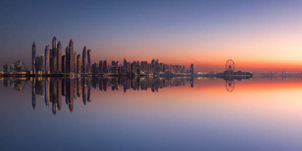 Panorama of Dubai Marina skyline at sunset stock photo