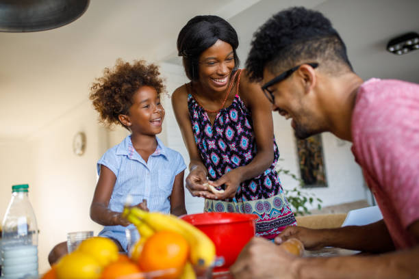 istock Family having fun in the kitchen while making cookies 918879984