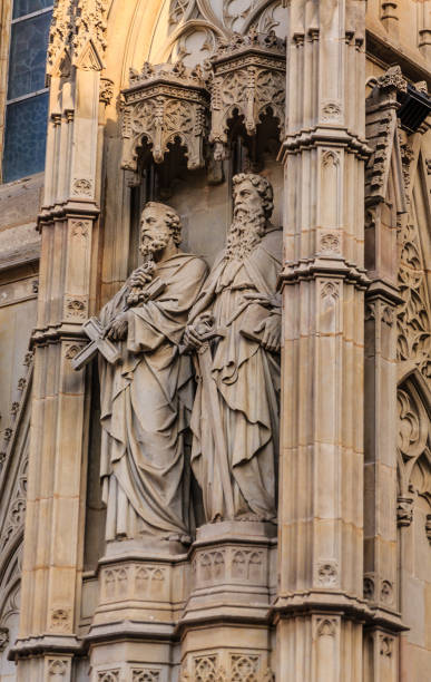 istock Statues of Two Priests on Church 918880594
