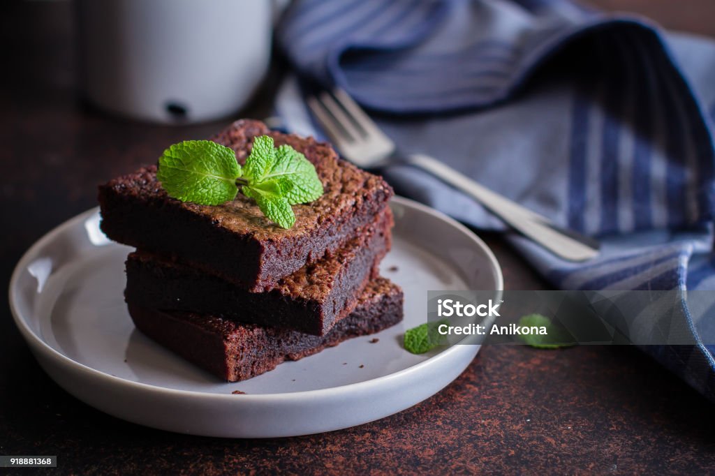 Homemade chocolate brownies on dark stone background, copy space Homemade chocolate brownies on dark stone background Baked Stock Photo