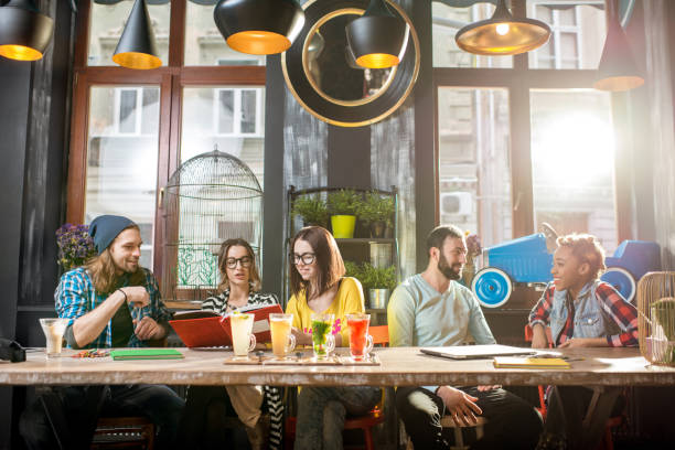 istock Friends sitting in the modern cafe 918881656