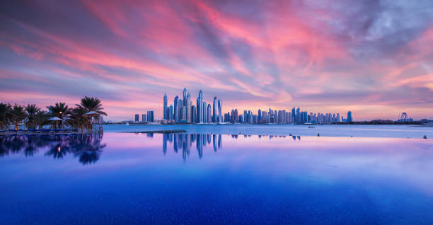 istock Skyline of Dubai Marina at a beautiful sunset with an infinity pool in front 918883052