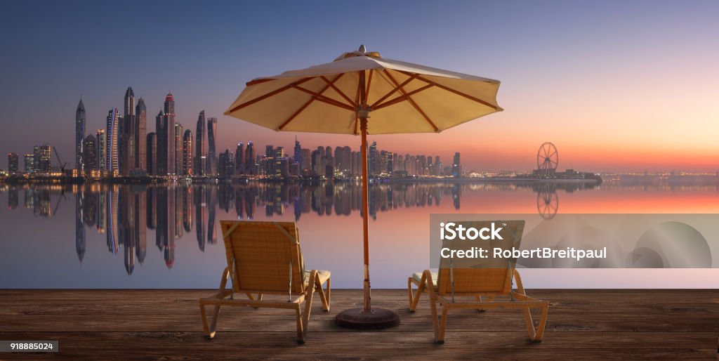 Beautiful beach in Dubai with the skyline of Dubai Marina on the horizon Dubai Stock Photo