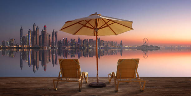 Beautiful beach in Dubai with the skyline of Dubai Marina on the horizon stock photo