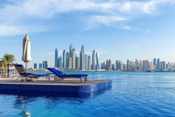 Pool view to Dubai Marina Pool view to Dubai Marina dubai stock pictures, royalty-free photos & images