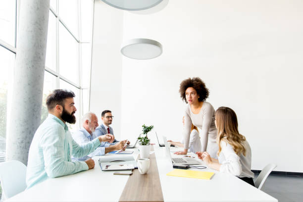 istock Business people around table during staff meeting 918893096