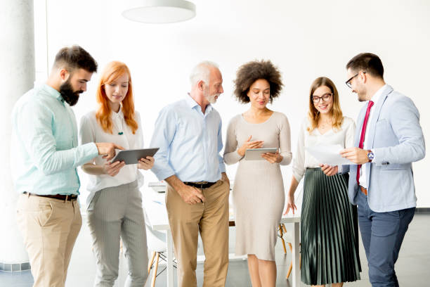 istock Multiracial business people standing in the office 918893122