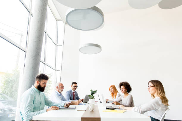 istock Business people around table during staff meeting 918893174