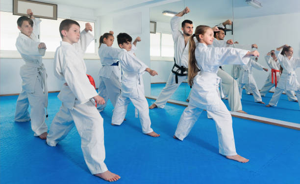 istock Teenagers practicing a new moves with master 918897148