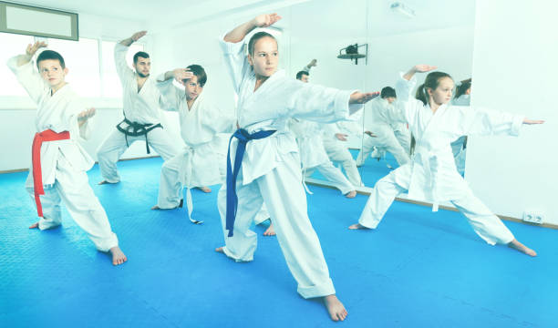 istock Children trying martial moves in karate class 918897202