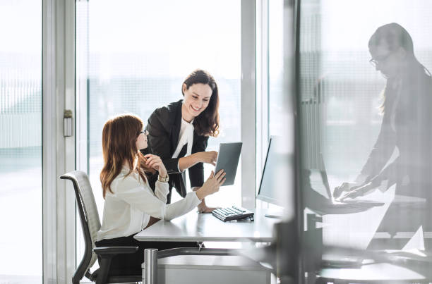 istock Three young businesswomen working in the office 918897434