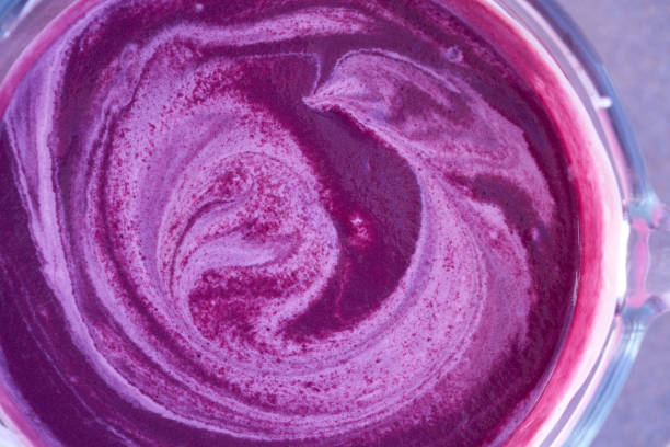 Acai bowl smoothie preparation with blender