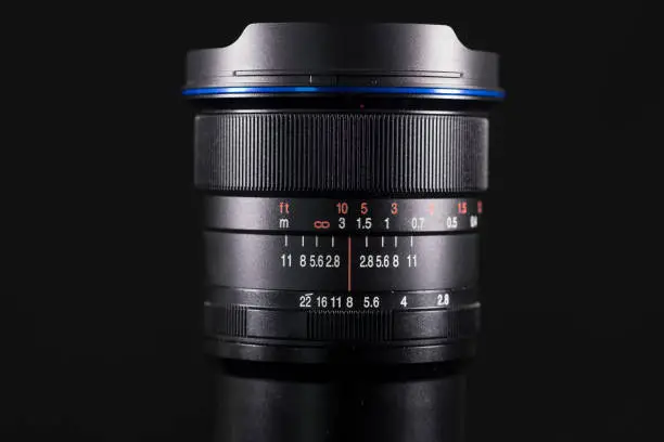 Image of digital camera lens with dark background in the studio