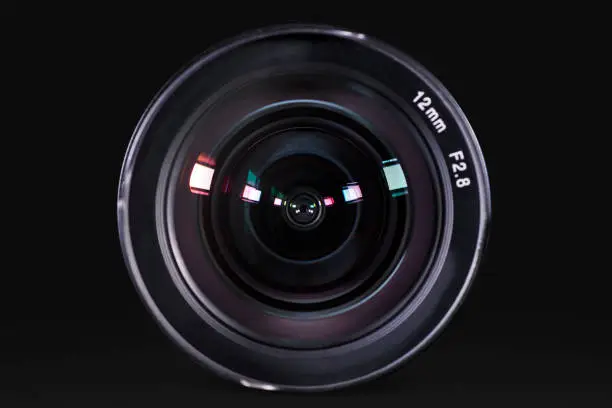 Picture of professional digital camera lens with dark background in the studio
