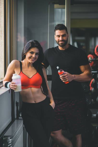 Young fit couple at gym stock photo