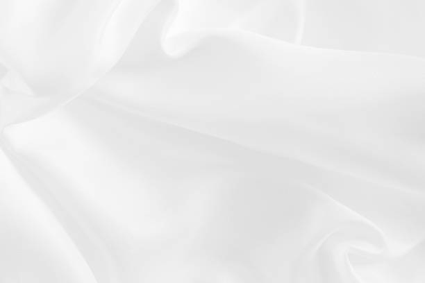 istock White fabric texture for background and design, beautiful pattern of silk or linen. 918910692