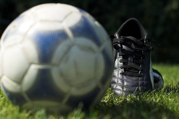 istock Soccer boots and ball 91891350
