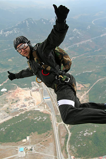 jump - skydiving air aerial view vertical stock-fotos und bilder