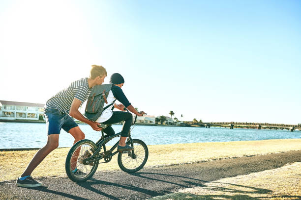 istock Sometimes you need a push from your older brother 918915578