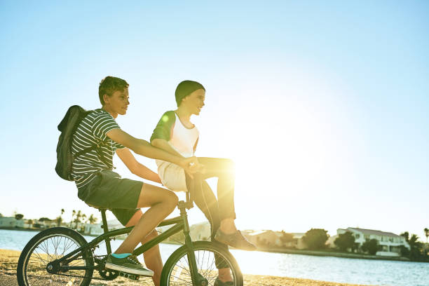 istock Brothers on a bike 918915642