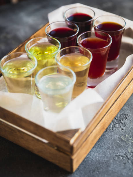 istock Assorted alcoholic cordials in a wooden box. Alcoholic drinks in restaurant 918915744