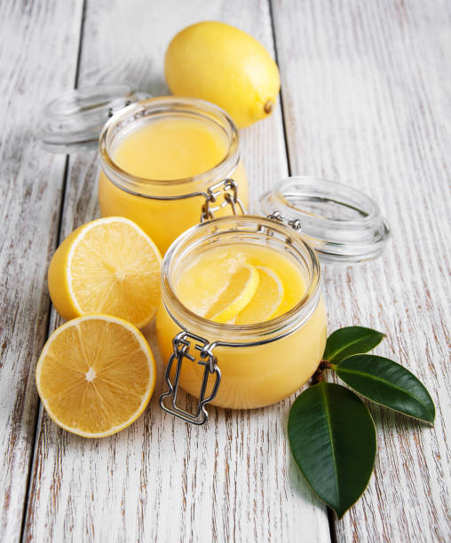 istock Lemon curd in glass jar with fresh lemons 918923444