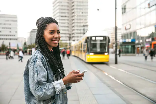 Black teenage woman commuting in Berlin - Alexanderplatz