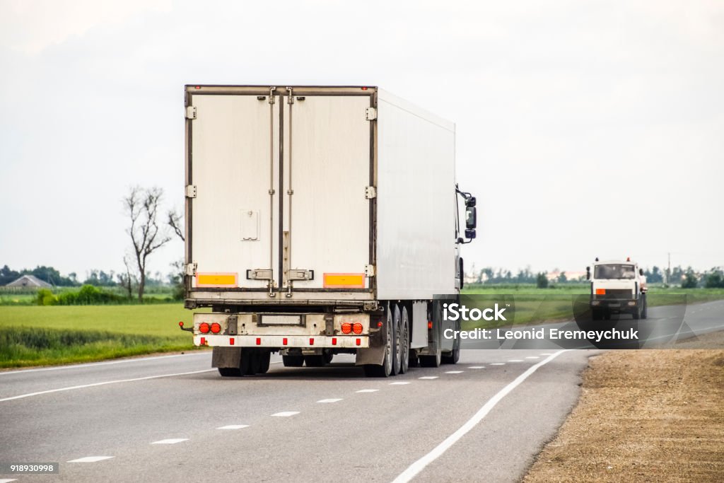 Freight vehicles on the track. Freight car. Truck. Freight vehicles on the track. Freight car. Truck Semi-Truck Stock Photo