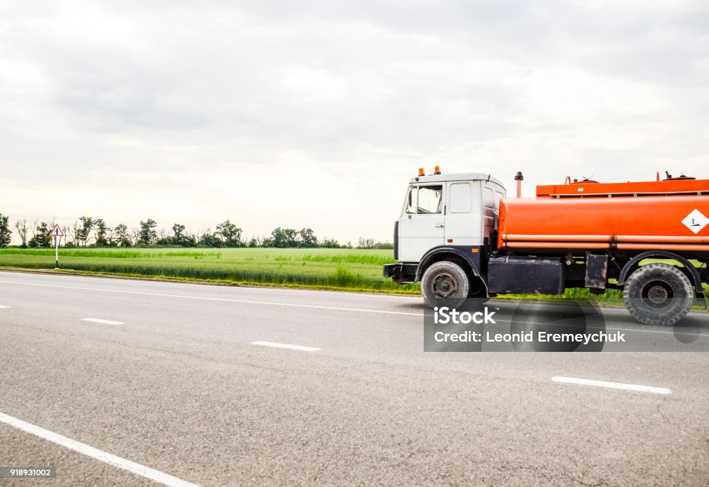 Transportation of flammable liquids. Transportation of flammable liquids. Freight vehicles on the track. Freight car. Truck Agricultural Field Stock Photo