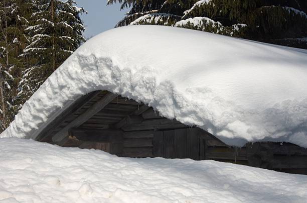 beautiful hut with much snow stock photo