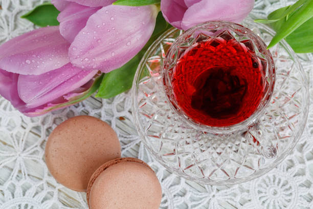 istock cup of karkadeh red tea with macaroons and tulips 918934890