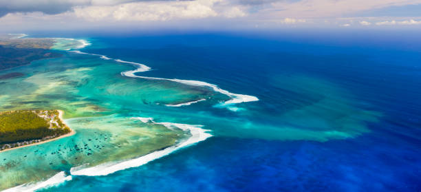 Aerial view of the underwater waterfall. Amazing Mauritius landscape. Panorama