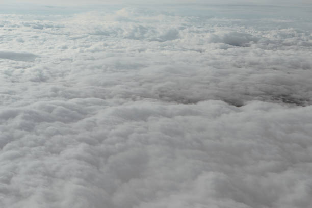 istock Clouds, view from the window of airplane flying in the clouds 918938322