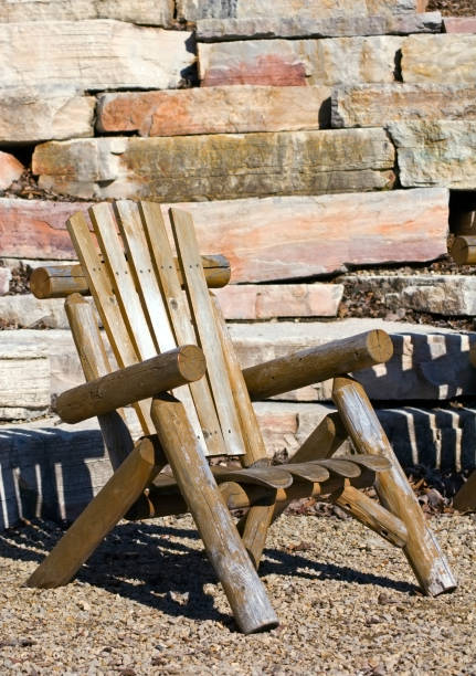 istock Adirondack Chair with Rock Wall Background 91894533