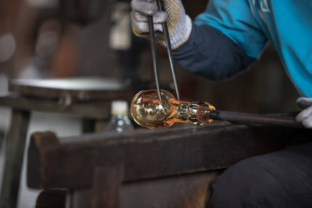 istock Molten glass on a metal rod 918947250