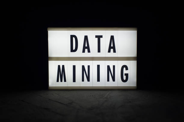 istock Data mining - text on a luminous display in the dark. Cryptocurrency news. 918951440